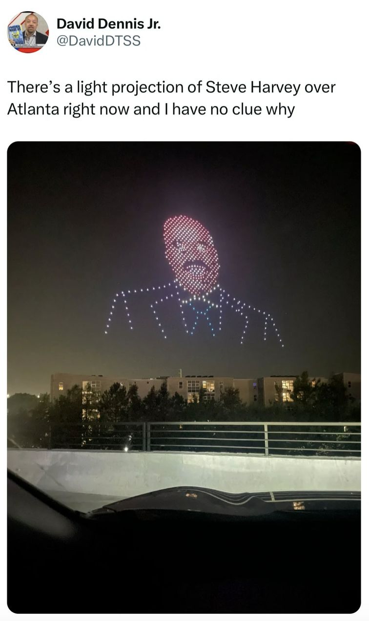 Photograph - David Dennis Jr. There's a light projection of Steve Harvey over Atlanta right now and I have no clue why